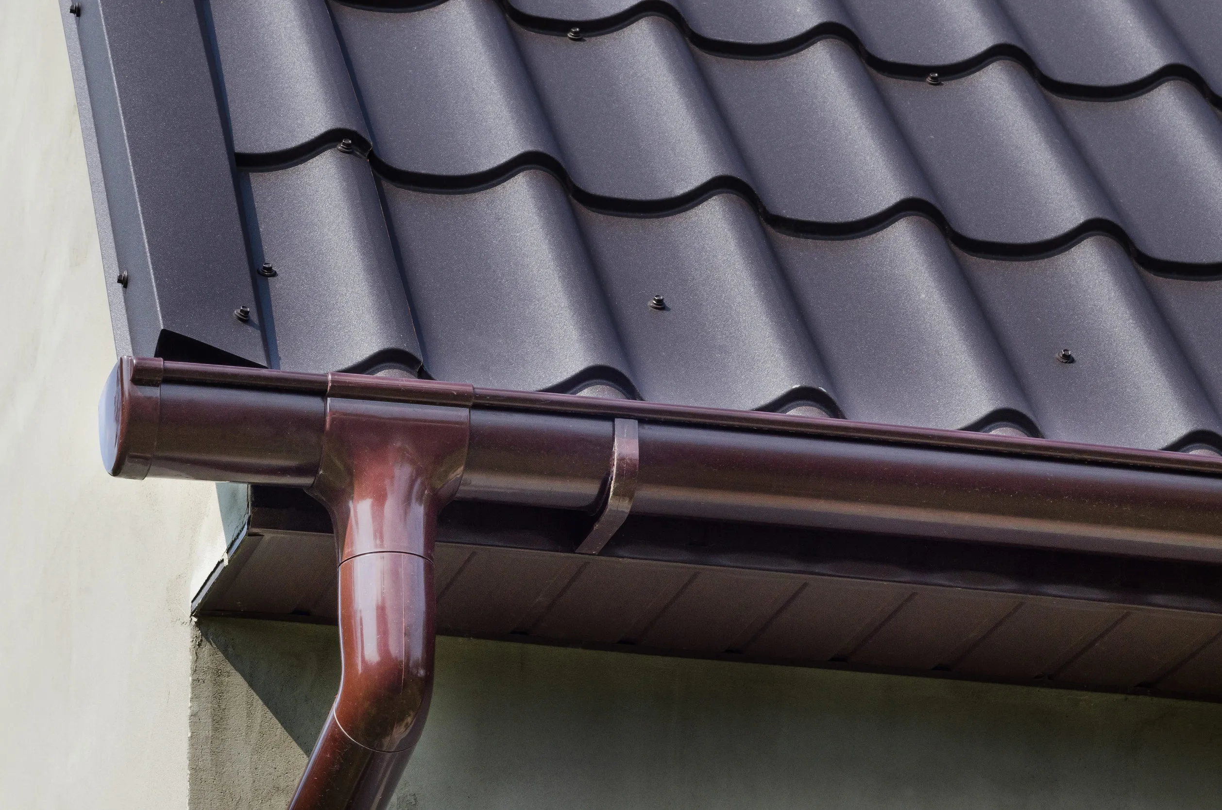 Corner of the house with gutter